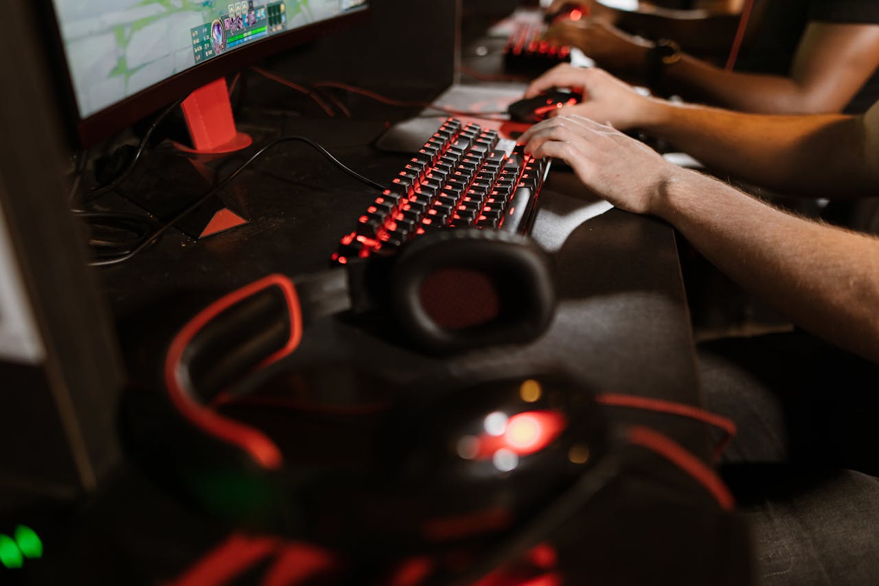 Home Close-up of gamers using mechanical keyboards during an intense esports session.